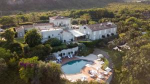 an aerial view of a house with a swimming pool at Donna Carmela Resort & Lodges in Riposto