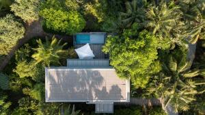 an overhead view of a house in the middle of trees at Donna Carmela Resort & Lodges in Riposto