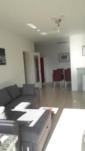 a living room with a couch and a table at Ferienwohnung Siesta in Bad Harzburg +13 photos