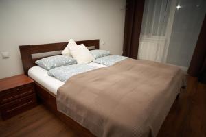 Posteľ alebo postele v izbe v ubytovaní Apartman A&M