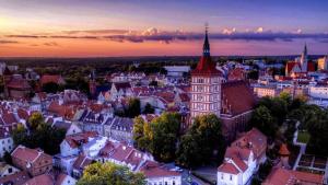 an aerial view of a city at sunset at kameralny apartament in Olsztyn