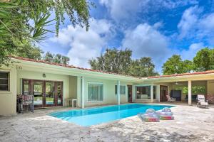 a home with a swimming pool and a patio at 7545 Southwest 124th Street in Miami