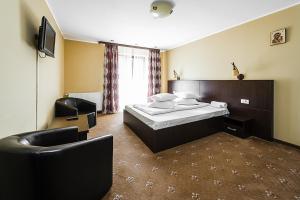 En eller flere senge i et værelse på Casa Ligiana