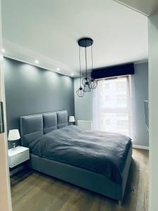 מיטה או מיטות בחדר ב-Motława