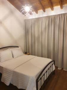 מיטה או מיטות בחדר ב-Melissonas Villas