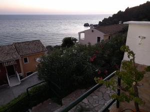 a view of the ocean from a house at Glyfada New Era Home 107 Menigos Resort Apartments in Glyfada