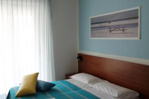 Postel nebo postele na pokoji v ubytování Hotel Villa Truentum