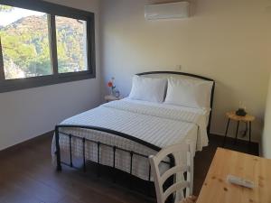 Postel nebo postele na pokoji v ubytování Melissonas Villas