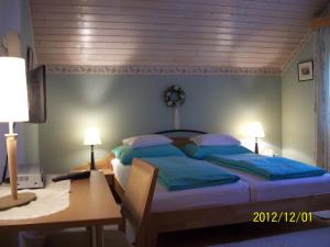 Tempat tidur dalam kamar di Haus Loidl