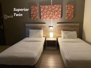 Postel nebo postele na pokoji v ubytování SH Hotel Kota Damansara