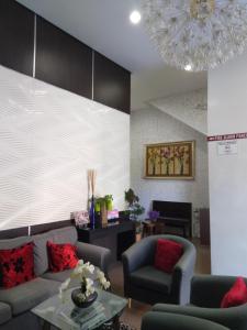 Posezení v ubytování Ginasuite Kompleks27 Hotel