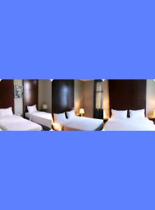 Postel nebo postele na pokoji v ubytování Ginasuite Kompleks27 Hotel