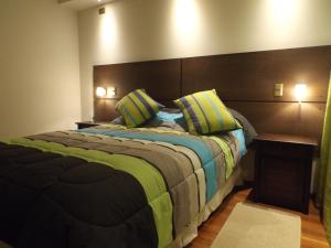 A bed or beds in a room at Hostal La Cumbre