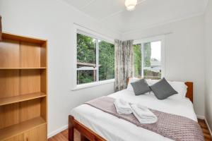 3 Bedroom In Onehunga w Parking - Wifi - Netflix tesisinde bir odada yatak veya yataklar
