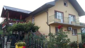 a house with a fence in front of it at Prenoćište " Ruža" in Višegrad +21 photos