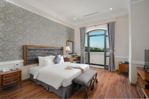 Postel nebo postele na pokoji v ubytování AVS Hotel Phu Quoc