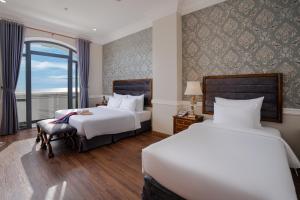 Postel nebo postele na pokoji v ubytování AVS Hotel Phu Quoc