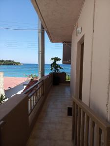 a balcony with a view of the ocean at Buganvilla Sea View apts in Agia Pelagia