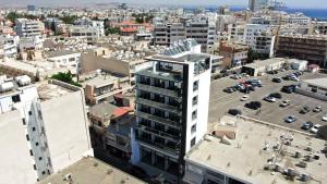 an aerial view of a city with buildings at Jimmy's Suites in Larnaca