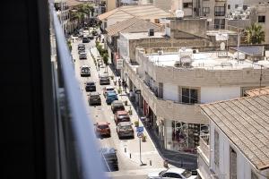 an overhead view of a city street with parked cars at Jimmy's Suites in Larnaca