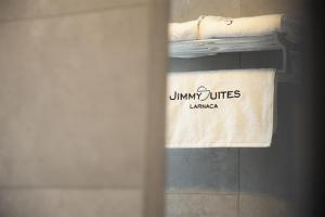 a towel on a towel rack in a bathroom at Jimmy's Suites in Larnaca