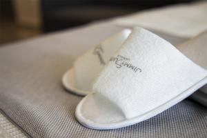 a pair of sandals sitting on top of a table at Jimmy's Suites in Larnaca