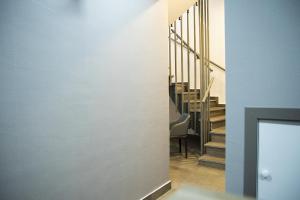 a view of a hallway with a staircase in a house at Jimmy's Suites in Larnaca