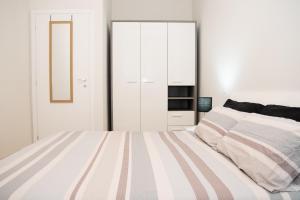 En eller flere senger på et rom på La Dimora del Cardinale