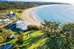 an aerial view of the beach and the ocean at Beachfront One, Mollymook in Mollymook