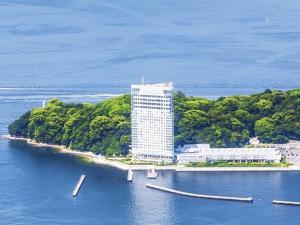 a large building on an island in the water at Grand Prince Hotel Hiroshima in Hiroshima