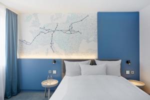Postel nebo postele na pokoji v ubytování H4 Hotel Leipzig
