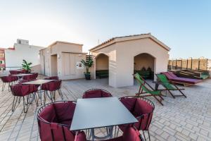 a group of tables and chairs on a patio at Nou Baleares in Palma de Mallorca