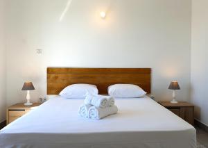 Postel nebo postele na pokoji v ubytování Appartement Etamine, l'Ermitage les Bains, proche du lagon pour 6 personnes