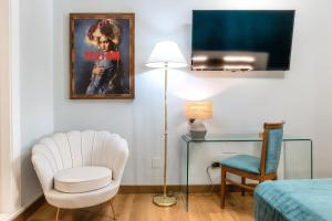Uma televisão e/ou sistema de entretenimento em Hotel Paba