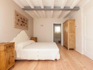 Giường trong phòng chung tại Le Pervinche