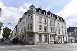 a white building on the side of a street at Fewo Wuppertal in Wuppertal