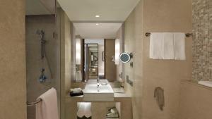 a bathroom with a sink and a mirror at Holiday Inn Jaipur City Centre, an IHG Hotel in Jaipur