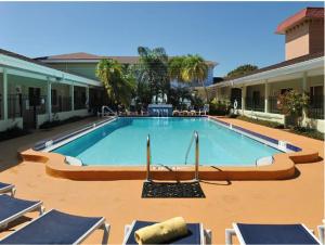 a large swimming pool in the middle of a building at Hotel SOL in St Pete Beach