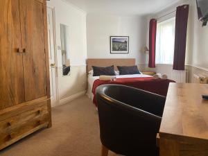 Postel nebo postele na pokoji v ubytování Byways Serviced Apartments