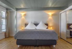 Ένα ή περισσότερα κρεβάτια σε δωμάτιο στο Gutshaus No3