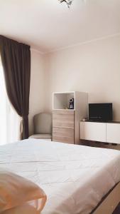 Postel nebo postele na pokoji v ubytování Hotel Fontaine Bleue