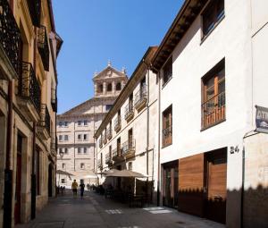 an empty street with a building in the background at ERASMUS PLAZA in Salamanca