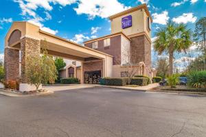 a front view of a hotel with a parking lot at Sleep Inn in Aiken