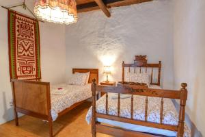 Postel nebo postele na pokoji v ubytování Casa Rural Tamia
