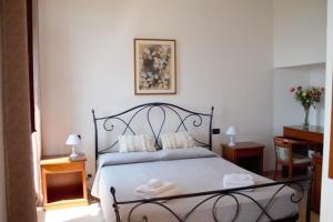 Ένα ή περισσότερα κρεβάτια σε δωμάτιο στο Villa Govi