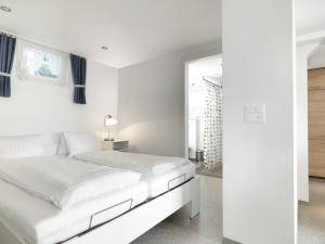 Voodi või voodid majutusasutuse Hotel B&BAlpenheim toas