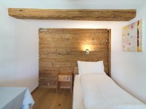 Voodi või voodid majutusasutuse Hotel B&BAlpenheim toas