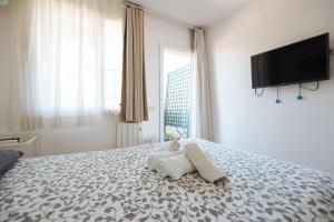 Postel nebo postele na pokoji v ubytování Apartamento Las Brisas II