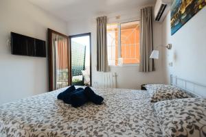 Postel nebo postele na pokoji v ubytování Apartamento Las Brisas II