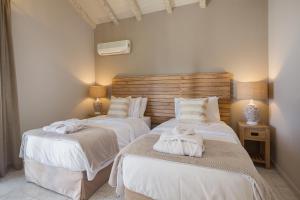 Кровать или кровати в номере Angouletta Villa by PaxosRetreats